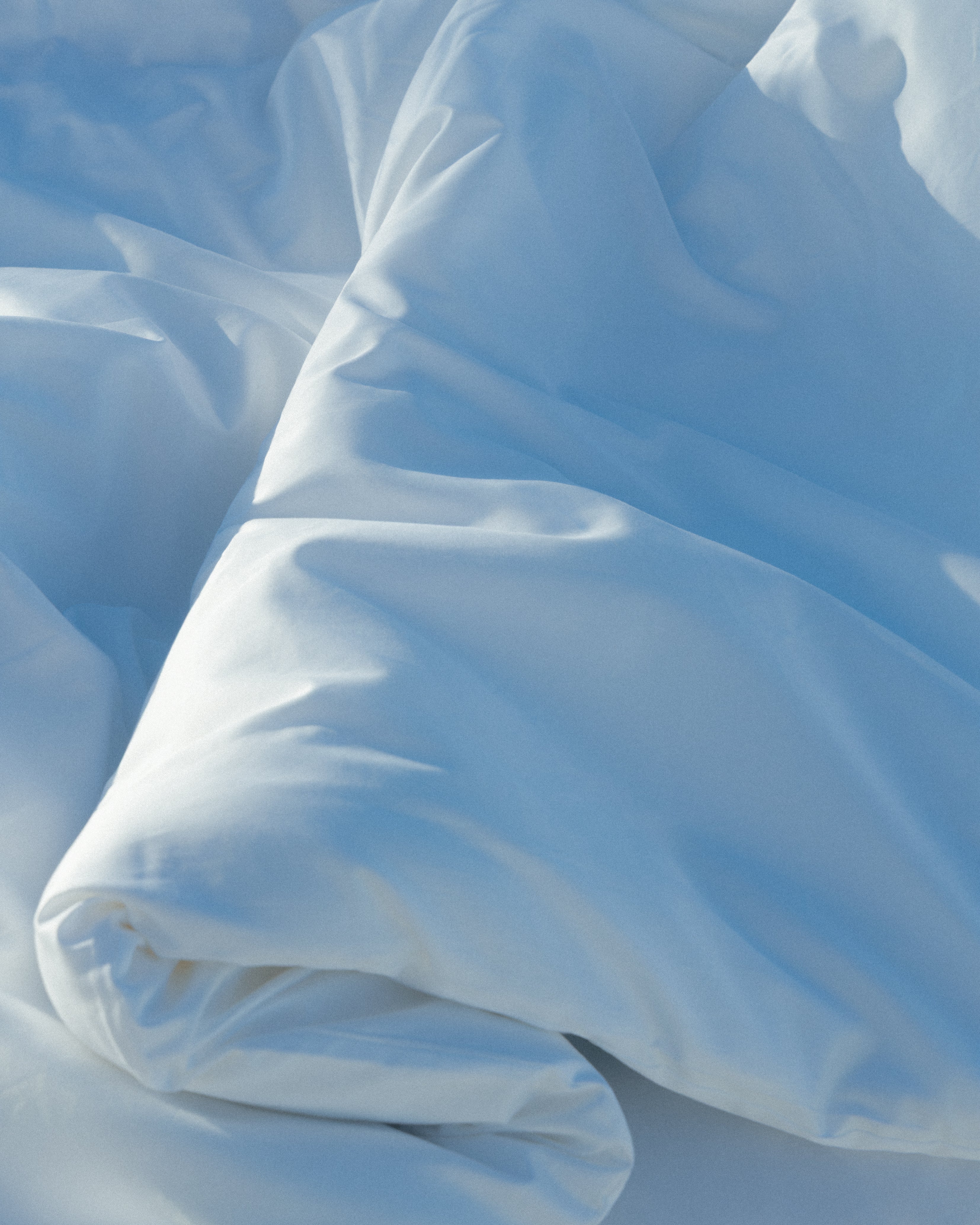 closeup of soft duvet in soft sun
